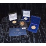 A lot of Souvenir Crowns, An Eisenhower Uncirculated Silver Dollar and an Unusual Coin Penant