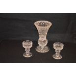 A Tyrone Crystal Footed Vase and a Pair of Tyrone Crystal Candlesticks