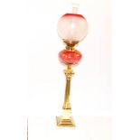 A Tall Brass Corinthian Pillar Oil Lamp, Ruby Bowl and Ruby Etched Shade