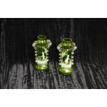 A Pair of Mary Gregory Green Glass Vases