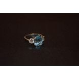 A Platinum Set Aqua (3.94ct) and Diamond Ring (1.02ct) Three Stone Diamond Ring