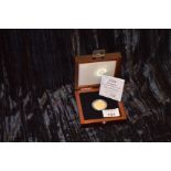A 14ct Gold 'Lady of the Century' 50 Dollar Gold Proof Coin
