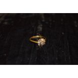 An 18ct Gold Diamond and Cluster Ring