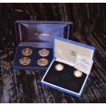 A Cased Royal Family Commemorative Coin Set and Two Silver Proof £1.00 Coins