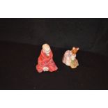 A Royal Doulton Figurine 'This Little Pig' and a Beswick Potter Figurine