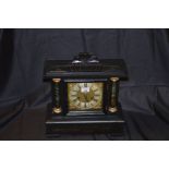 A Wooden Cased Mantle Clock