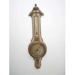 Een grijs geschilderde deels vergulde Franse barometer met kandelaar ornament vermoedelijk eind 18de