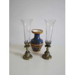 Twee kristallen vazen met bronzen montuur en een porseleinen vaas met bronskleurig montuur,