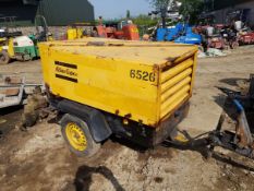 SINGLE AXLE TOWABLE ATLAS COPCO COMPRESSOR, STARTS, RUNS AND PRODUCES AIR. TWIN AIR OUTLETS