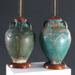 Associated pair ancient Islamic stoneware lamps