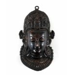 Buddha-Kopf. Dreiviertelrelief aus Kupfer. Bhutan/Nepal. H 23 cm