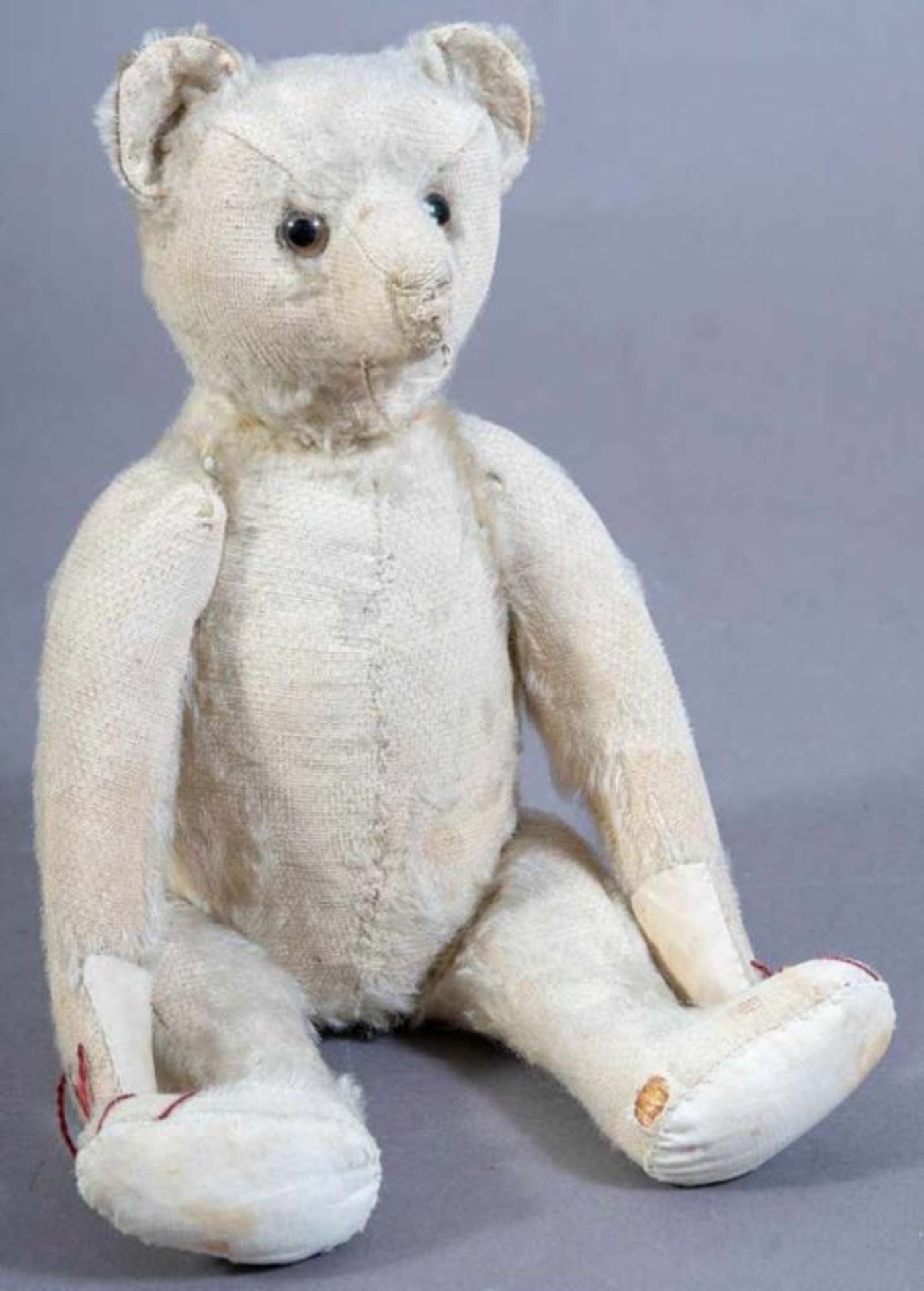 Antiker Teddy, Anfang 20. Jhd., Holzwolle-Füllung, bespielter Originalzustand, ursprünglich mit