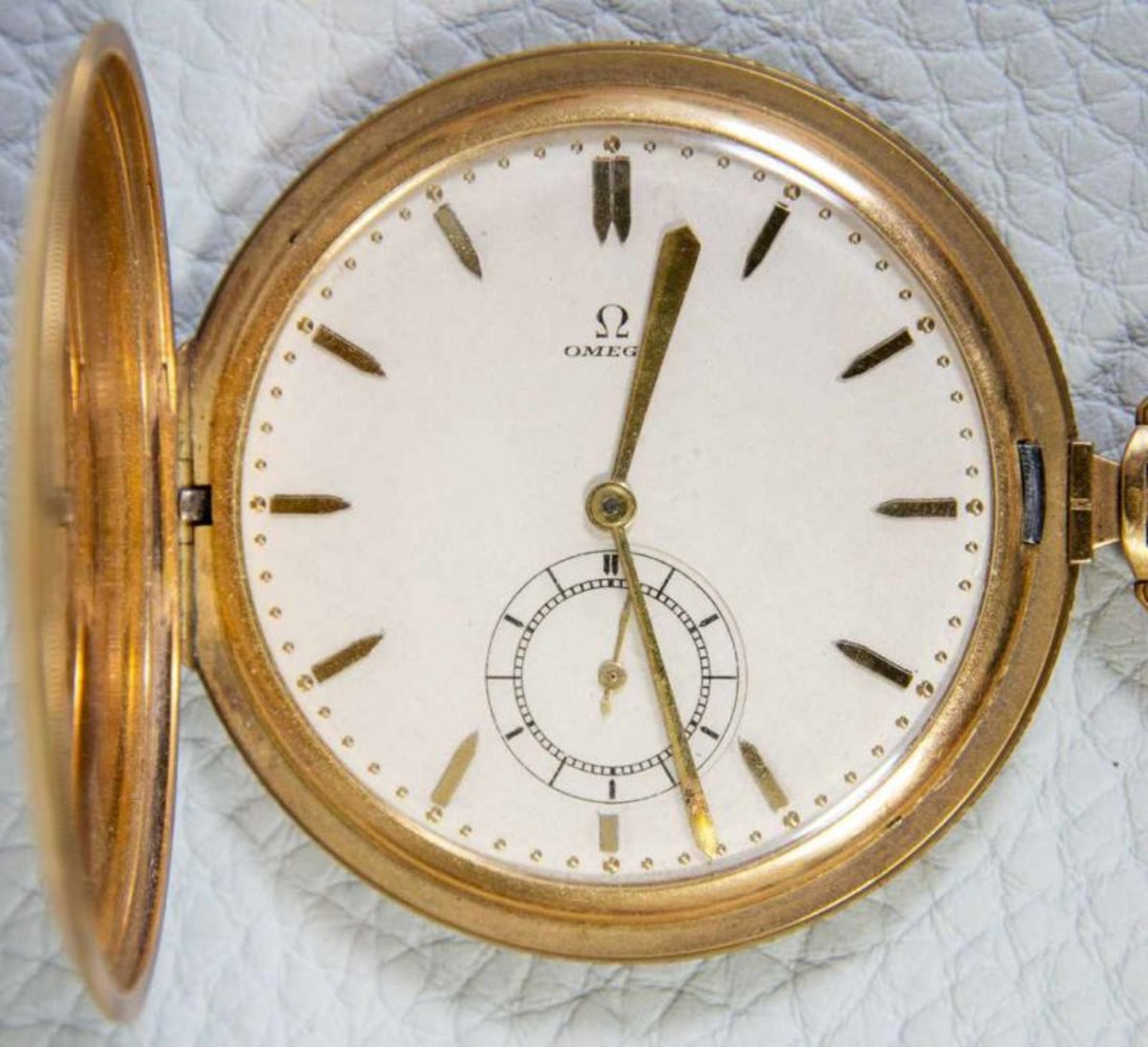OMEGA Sprungdeckeltaschenuhr, 585er/14K Gelbgoldgehäuse & Uhrenkette. Brutto ca. 79 gr. Werk läuft