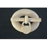 COLLECTABLES - A Victorian carved bone brooch, wit