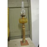 COLLECTABLES - An antique oil lamp with decorative