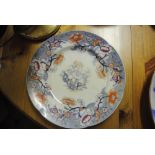 CERAMICS - An antique hand painted plate with unus