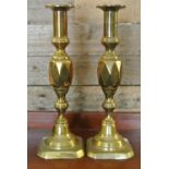 COLLECTABLES - A pair of antique brass candlestick