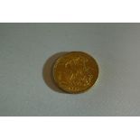 COINS - An 1887 Victorian Sovereign coin.