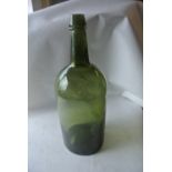 CERAMICS/ GLASS - A large antique green glass bott