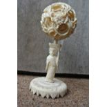 COLLECTABLES - An antique Oriental carved Ivory pu