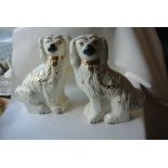 CERAMICS - A pair of Staffordshire Spaniels with g