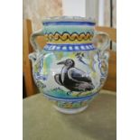 CERAMICS - An unusual hand painted pottery vase wi