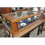 FURNITURE/ HOME - An antique wood cased glass coun