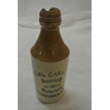 COLLECTABLES - A vintage stoneware bottle reading