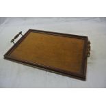 COLLECTABLES - An antique wooden tray with brass h