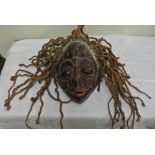 COLLECTABLES - A carved African mask with applied