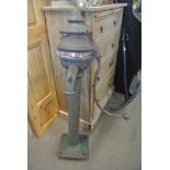 COLLECTABLES - An antique cast iron cowtail pump,
