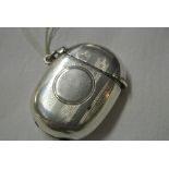 SILVER - An antique oval sterling silver vesta cas