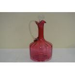 GLASS - An antique Ruby glass jug with decorative