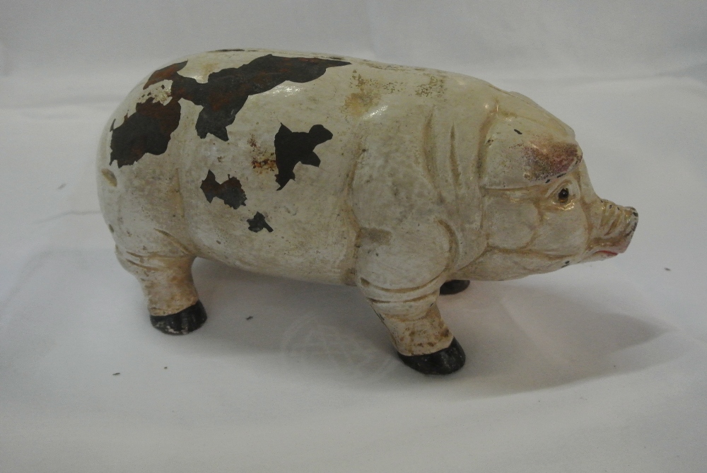 COLLECTABLES - An antique cast iron pig money box/