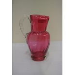 GLASS - An antique Ruby glass jug, measuring 12.5c