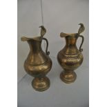COLLECTABLES - A pair of Indian brass jugs with co