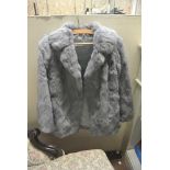 COLLECTABLES - A vintage blue/ grey fur coat.