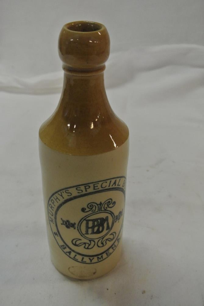 COLLECTABLES - A vintage stoneware bottle reading