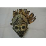 COLLECTABLES - A hand carved tribal mask with bamb