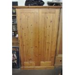 FURNITURE/ HOME - A large pine wardrobe with key.