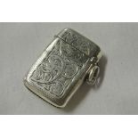 SILVER - A sterling silver vesta case with hand en