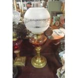 COLLECTABLES - An antique oil lamp with glass font