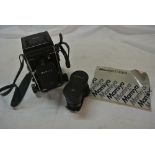 COLLECTABLES - A vintage Mamiya C330 camera with a