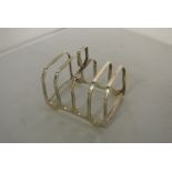 SILVER - A sterling silver 4 slice toast rack, ful