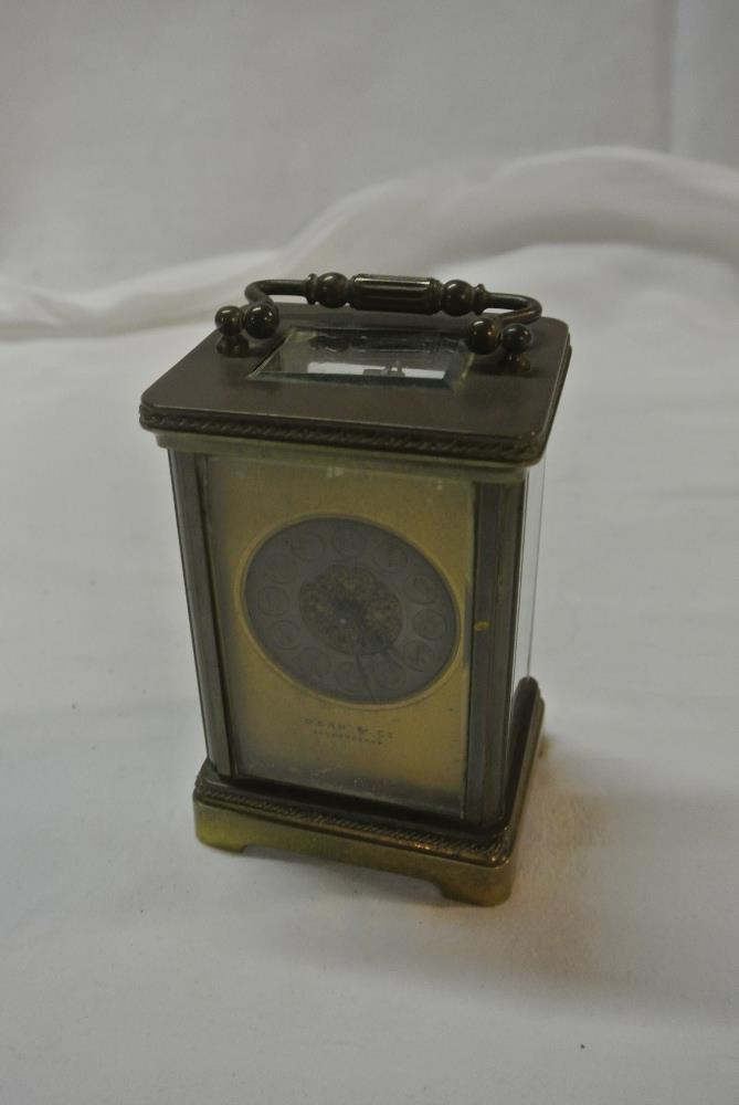 CLOCKS - An antique brass cased carriage clock, wi