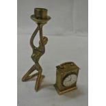 COLLECTABLES - A small brass quartz clock & figura