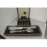 SILVER - A cased sterling silver handled fish knif