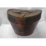 COLLECTABLES - An antique leather top hat box.
