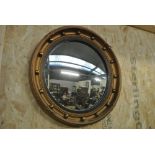 COLLECTABLES - A circular framed 'Butlers' convex