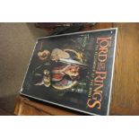 COLLECTABLES - A framed Lord of the Rings poster.